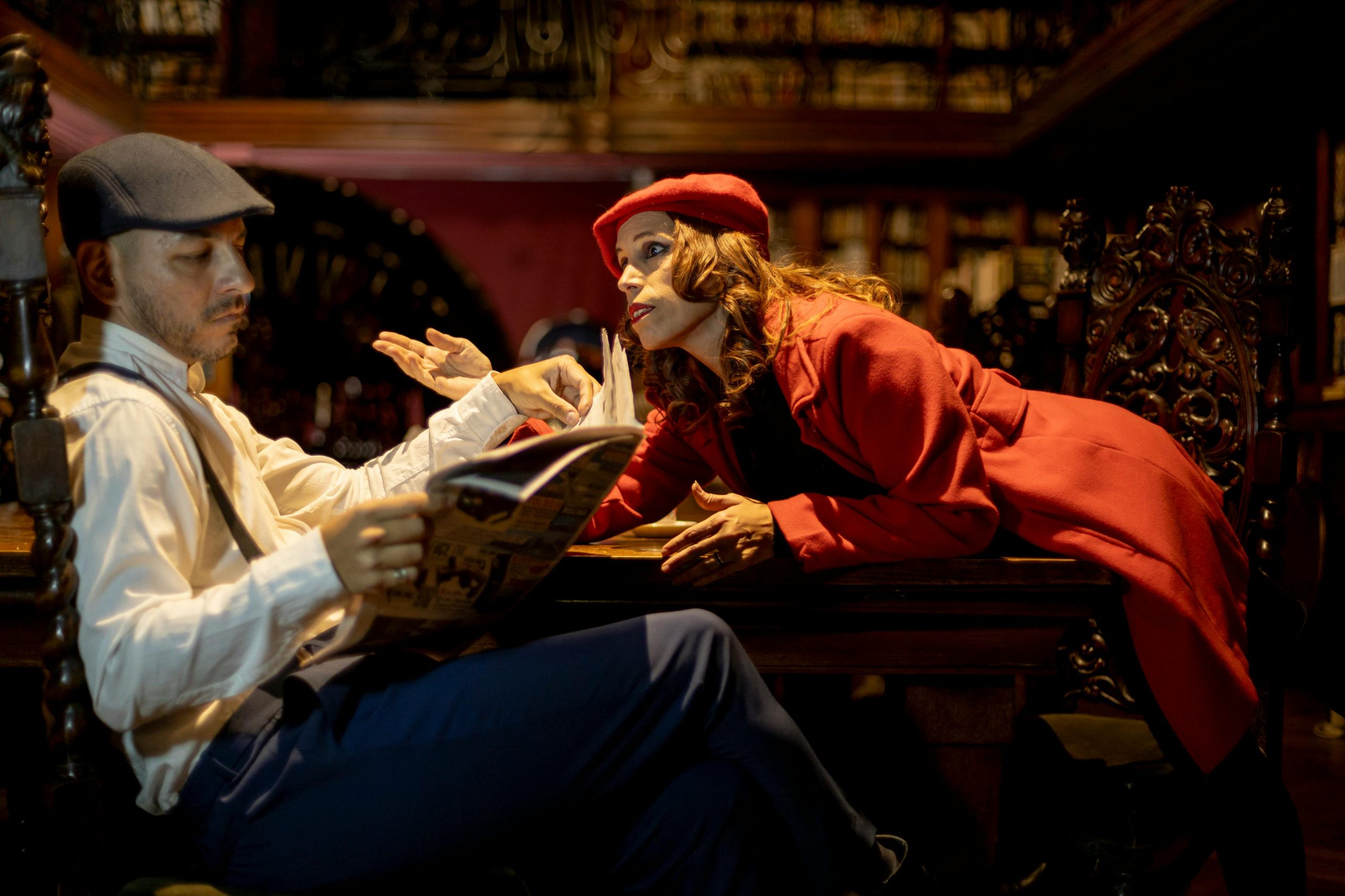 A couple engaged in a dramatic conversation in a vintage library setting in Buenos Aires.